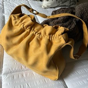 Hobo handbag H 9", L 14", W 4". Color is Marigold